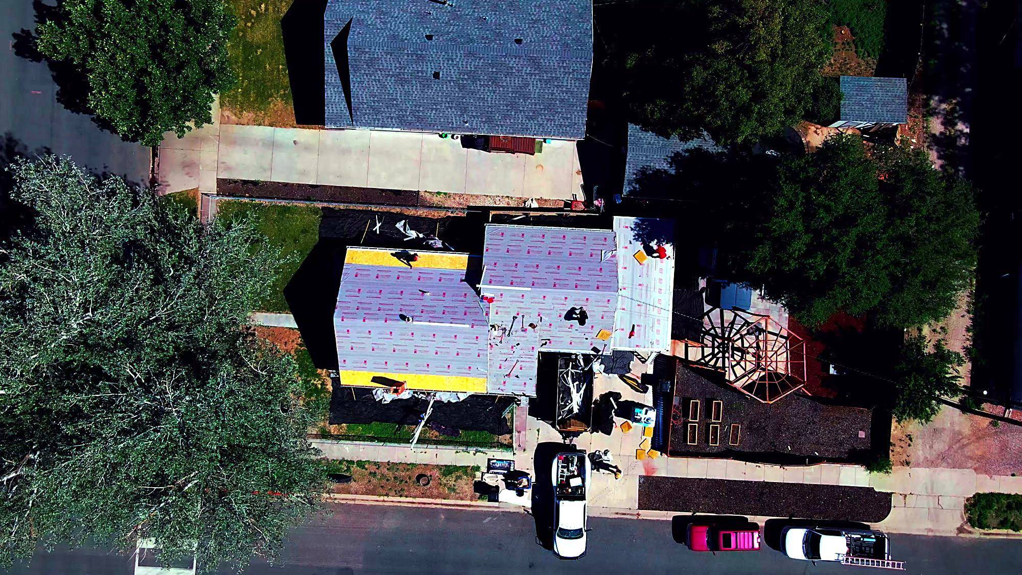Aerial view of a Schank Roofing crew replacing a residential roof in Western Nebraska