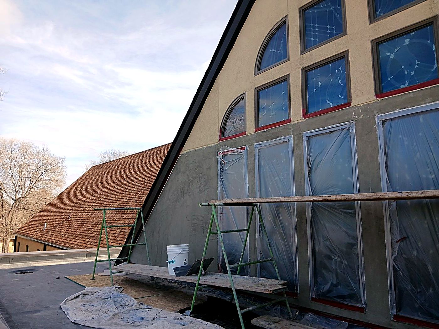 Scaffold work on the window wall of Christ The King Catholic Church in Gering