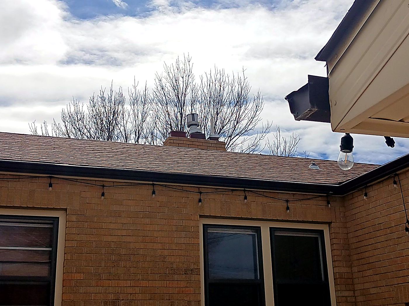Roof edge, fascia and gutter line on a home in Gering, photographed from below